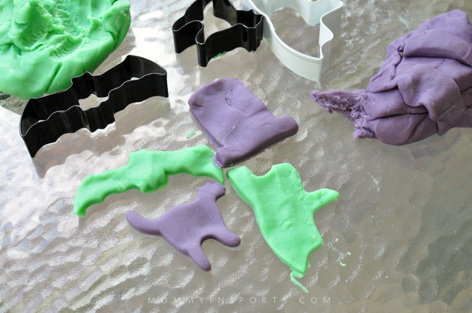 Adorable White Halloween Play Dough on a Purple Plate · Creative Fabrica