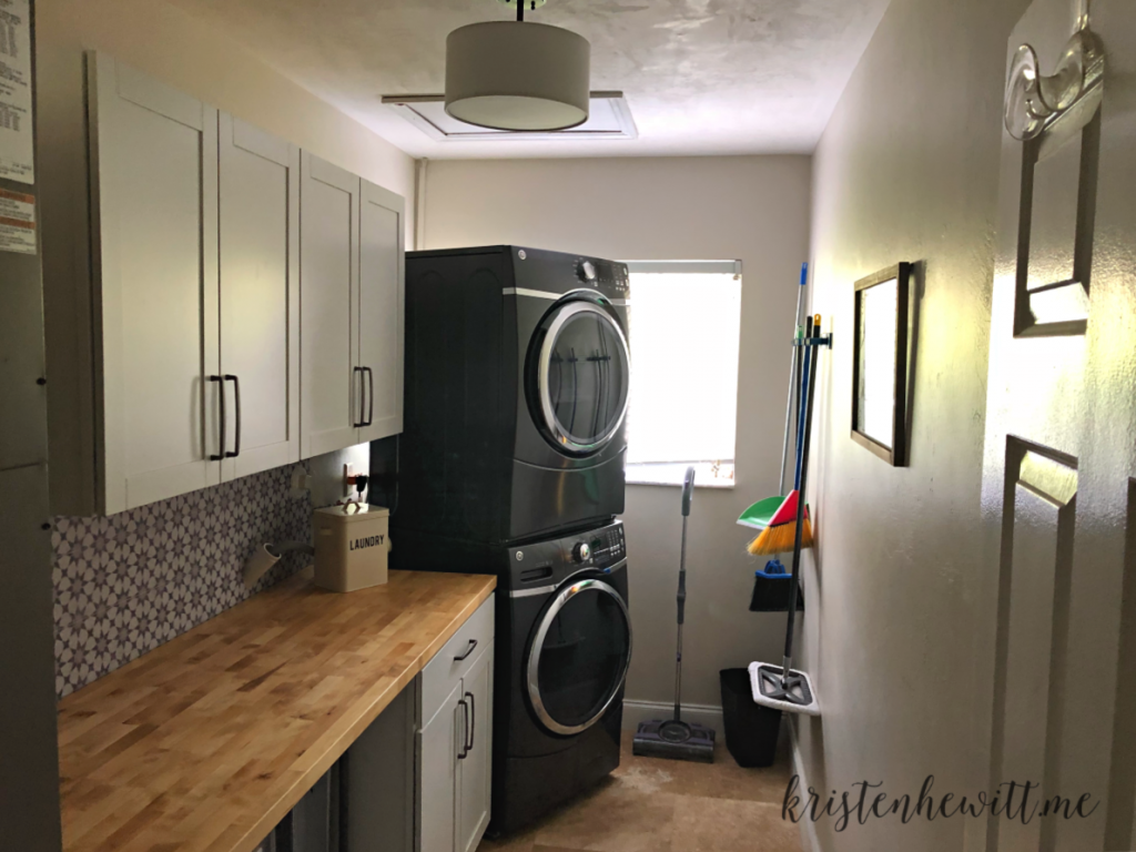 Looking for a simple and budget friendly way to reorganize your laundry room? Here's a DIY laundry room makeover you can do in a weekend!